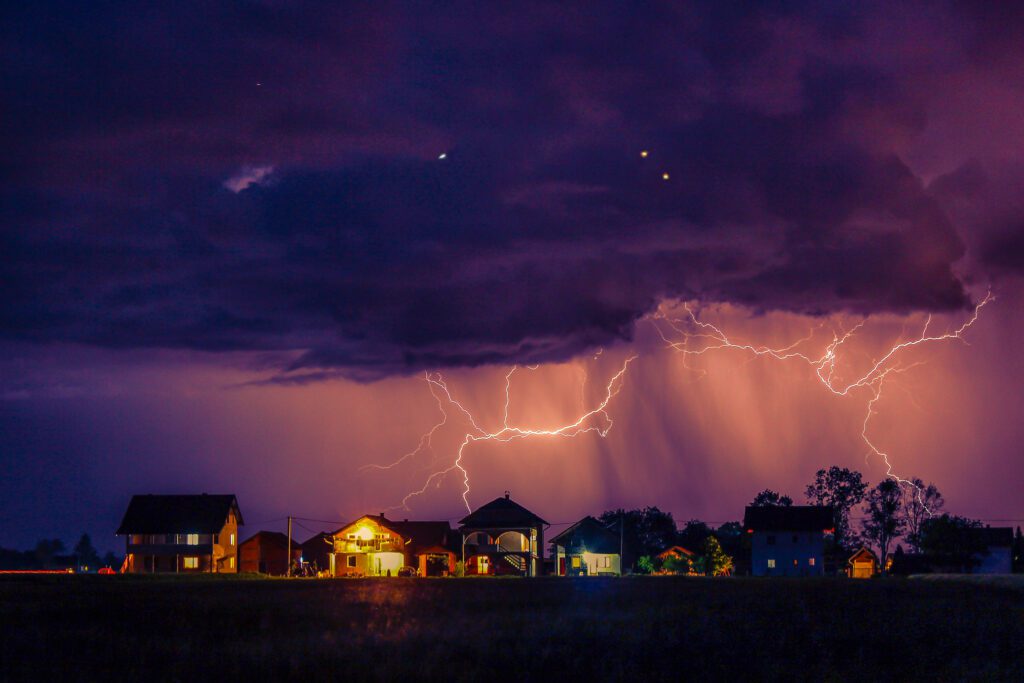lightning above a row of houses