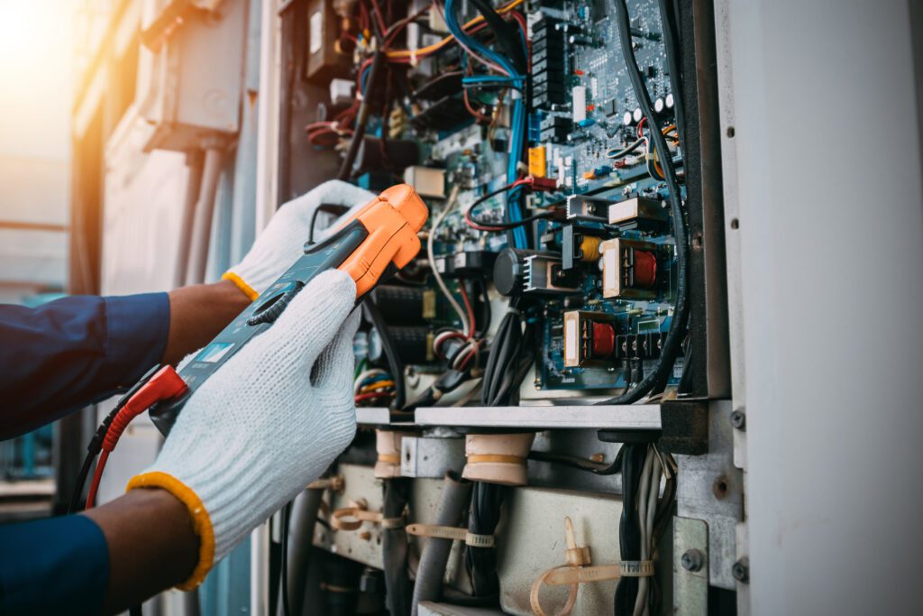 hands in front of an electrical panel